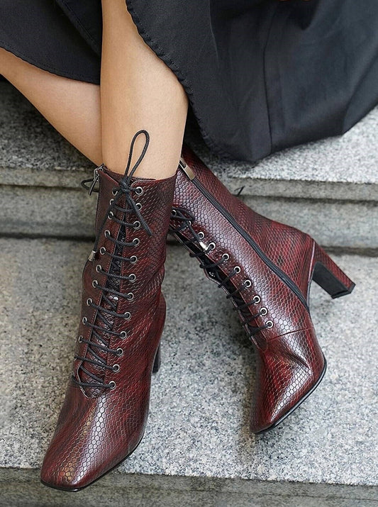 snake printed lace up boots