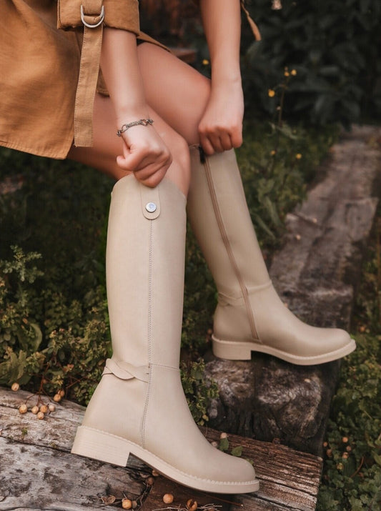 high-knee beige boots